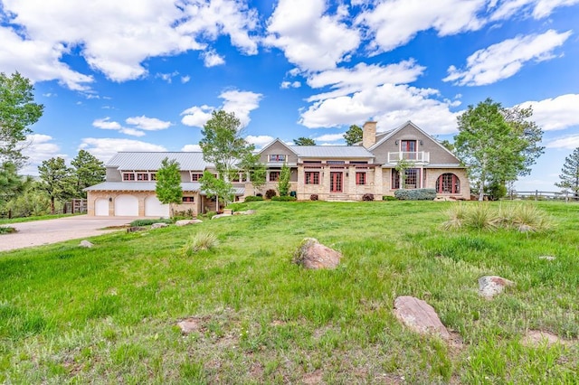 6430 Signal Mountain Rd, Beulah, CO 81023 - view of front of house featuring driveway, a chimney, a front yard, metal roof, and an attached garage