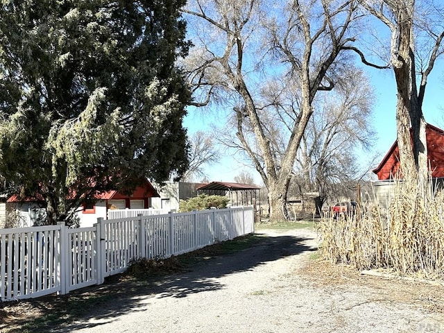 view of road featuring gravel driveway