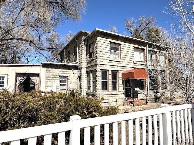 view of front of home with fence