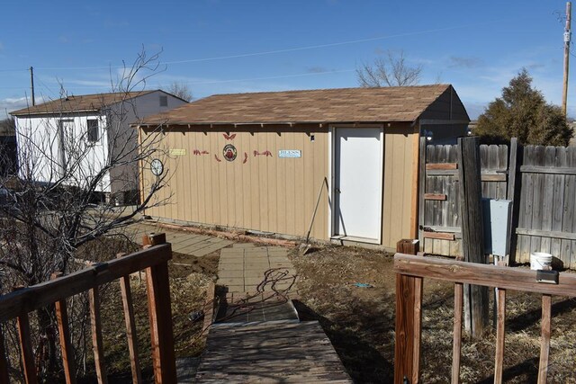 view of shed with fence