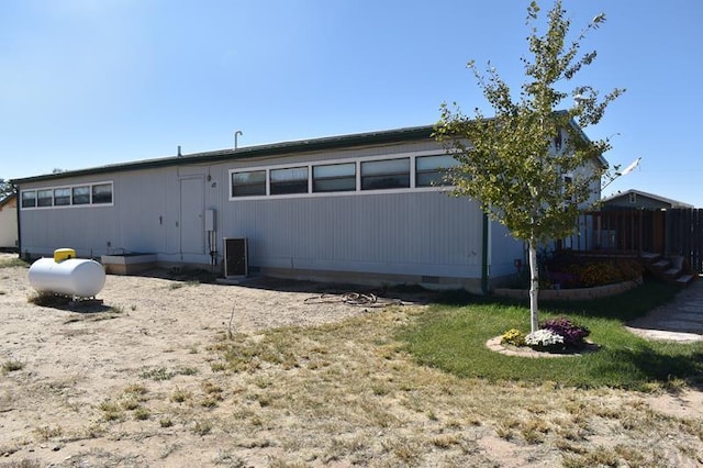 back of property featuring fence