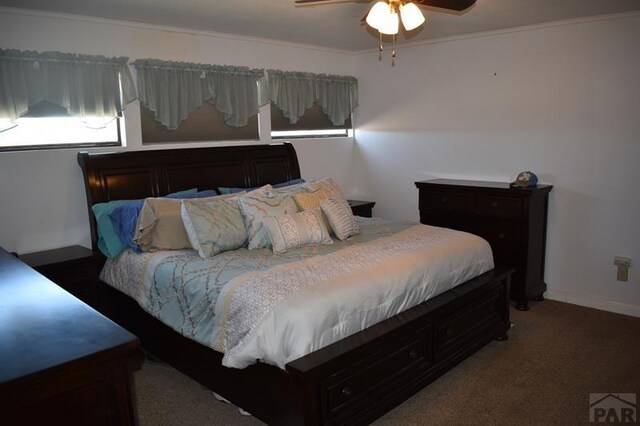 bedroom with dark colored carpet and ceiling fan