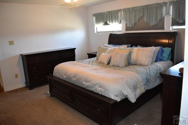 bedroom with light carpet and baseboards