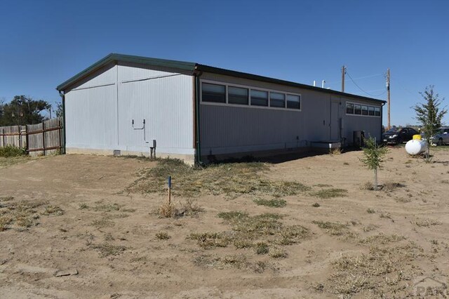 view of outdoor structure featuring fence