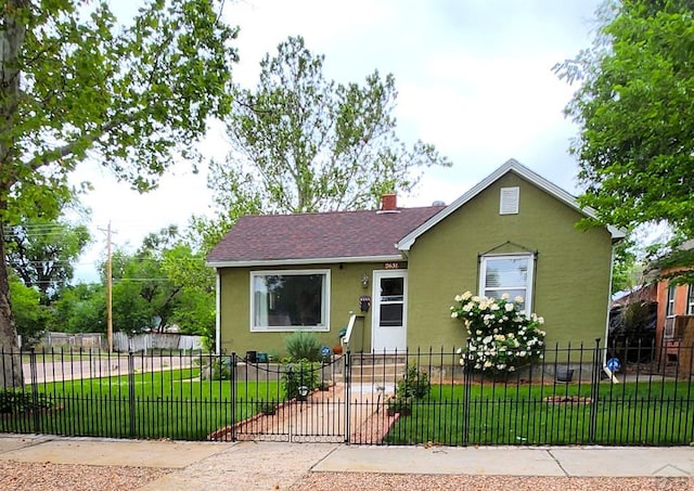 2631 Cedar St, Pueblo, CO 81004 - bungalow-style home featuring stucco siding, a chimney, and a shingled roof
