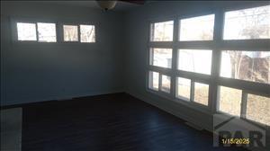 unfurnished room featuring plenty of natural light