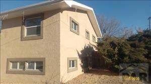 view of side of home with stucco siding