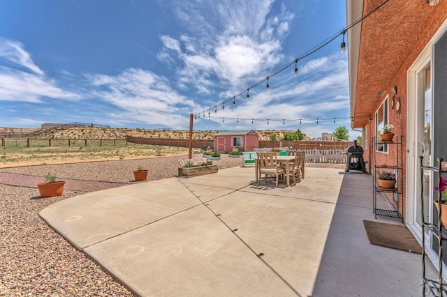 1284 N Challenger Dr, Pueblo West, CO 81007 - fenced backyard with outdoor dining space, a patio area, and a grill
