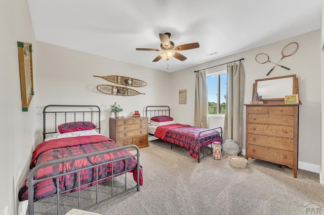 1284 N Challenger Dr, Pueblo West, CO 81007 - bedroom featuring carpet flooring, ceiling fan, and baseboards