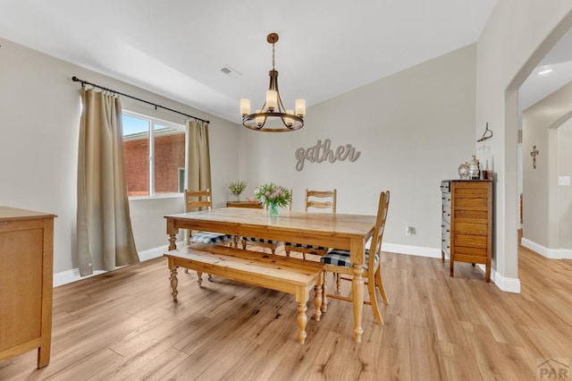 1284 N Challenger Dr, Pueblo West, CO 81007 - dining space with a chandelier, light wood-style flooring, and baseboards