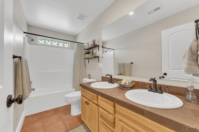 1284 N Challenger Dr, Pueblo West, CO 81007 - full bath featuring shower / tub combo with curtain, double vanity, toilet, and tile patterned floors