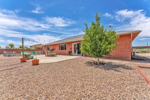 1284 N Challenger Dr, Pueblo West, CO 81007 - rear view of property with a patio