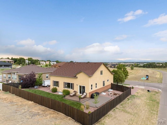 4288 Cedarweed Blvd, Pueblo, CO 81001 - rear view of house with a fenced backyard, stucco siding, and a patio area