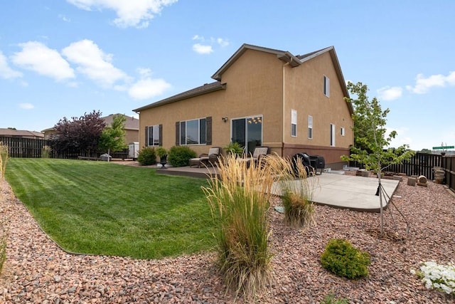 4288 Cedarweed Blvd, Pueblo, CO 81001 - back of property with a patio, a fenced backyard, and stucco siding