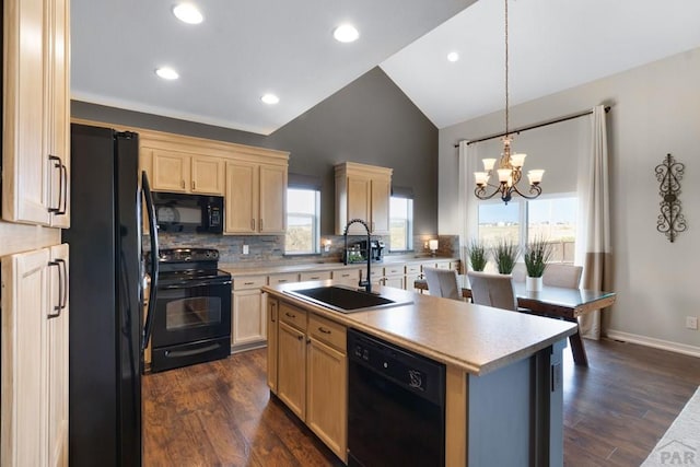 4288 Cedarweed Blvd, Pueblo, CO 81001 - kitchen with black appliances, light brown cabinetry, light countertops, a chandelier, and recessed lighting