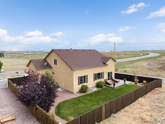 4288 Cedarweed Blvd, Pueblo, CO 81001 - rear view of property featuring stucco siding, a patio, a fenced backyard, and roof with shingles
