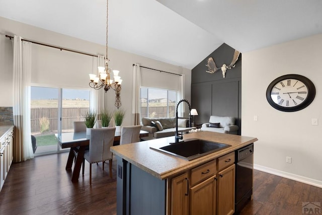 4288 Cedarweed Blvd, Pueblo, CO 81001 - kitchen with dishwasher, vaulted ceiling, a chandelier, dark wood finished floors, and light countertops