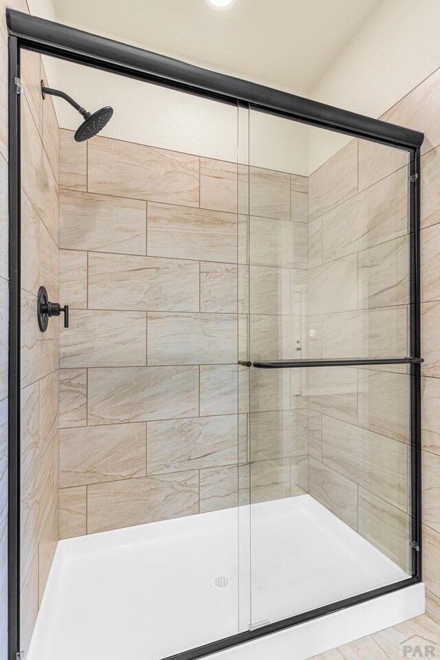 full bath featuring a stall shower