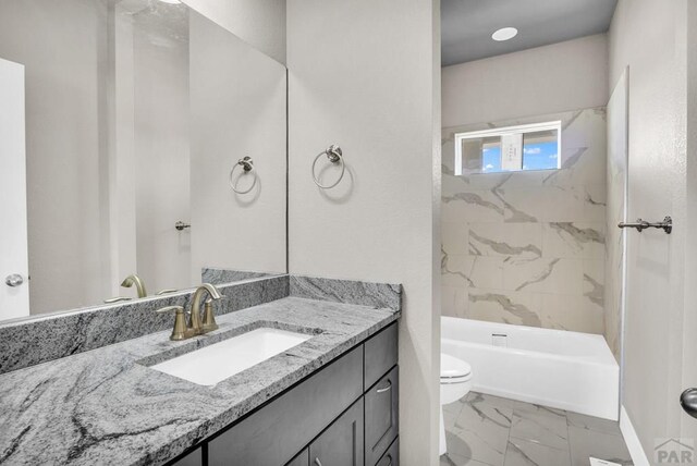 full bath featuring toilet, marble finish floor, shower / tub combination, and vanity