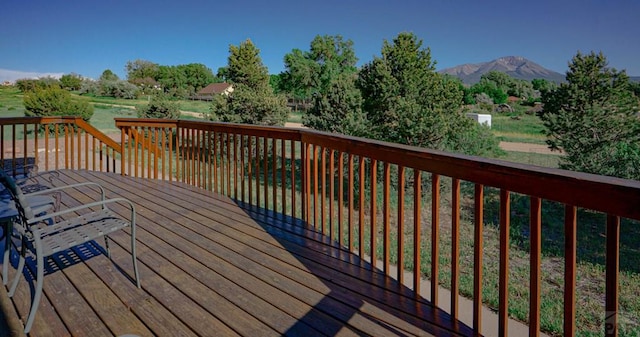 wooden terrace featuring a mountain view