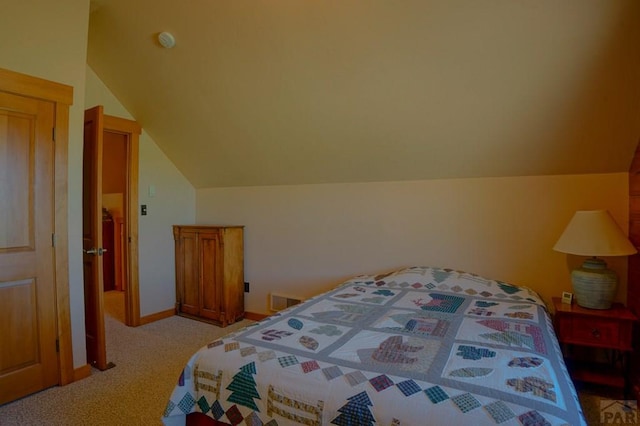 bedroom featuring lofted ceiling, light carpet, and baseboards