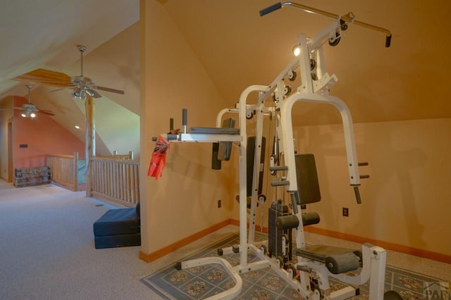 workout area with carpet floors, vaulted ceiling, and baseboards