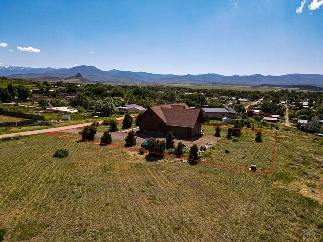 birds eye view of property with a mountain view