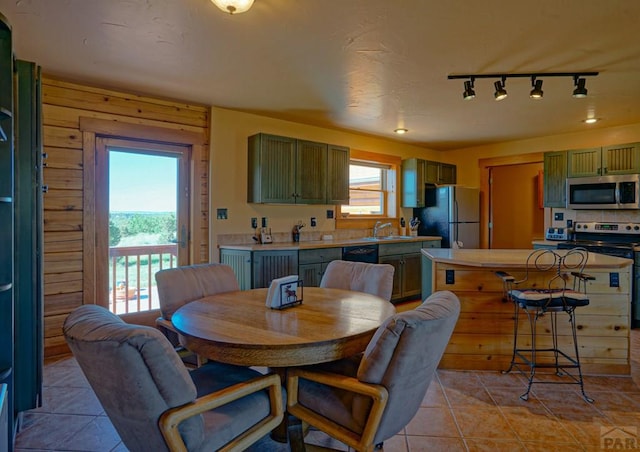 dining space with light tile patterned floors