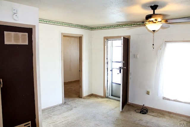2006 W 13th St, Pueblo, CO 81001 - empty room featuring light colored carpet, ceiling fan, and a smoke detector