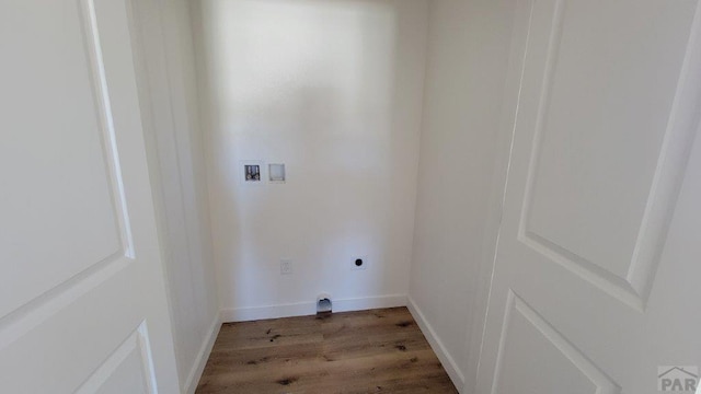 laundry area with wood finished floors, baseboards, hookup for an electric dryer, hookup for a washing machine, and laundry area