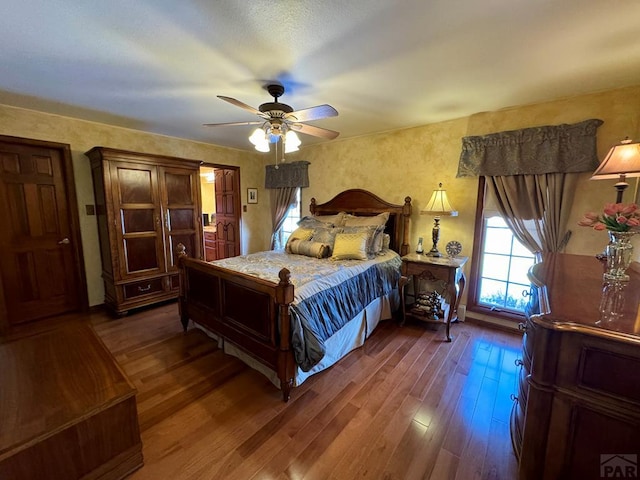 bedroom with wood finished floors and a ceiling fan