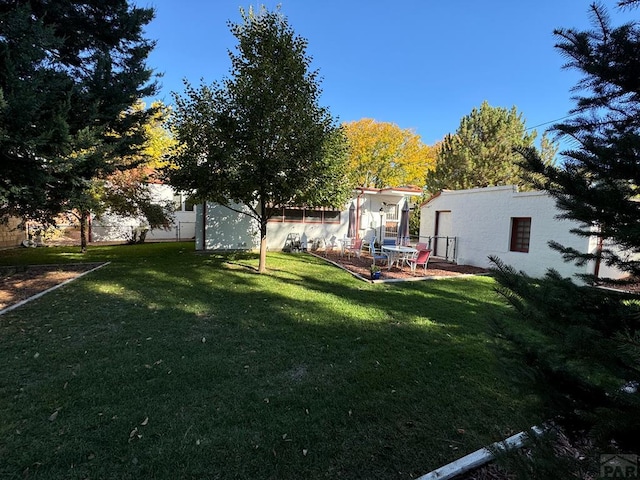 view of yard featuring a patio and fence