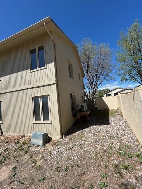 21 Terrace Dr, Pueblo, CO 81001 - view of side of home featuring a fenced backyard and central AC