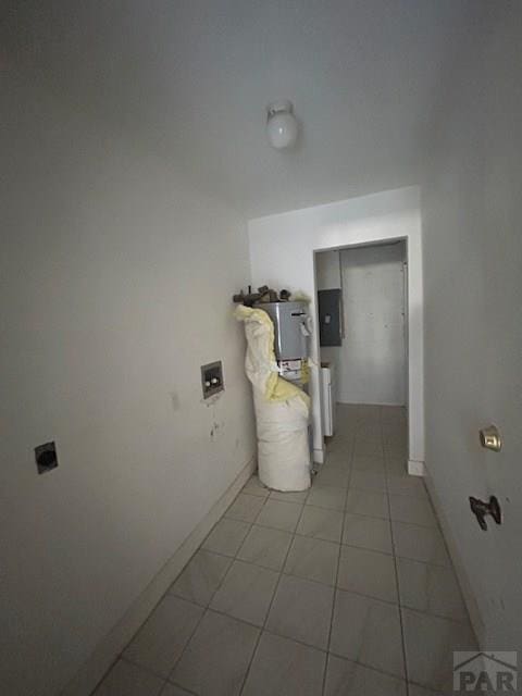 21 Terrace Dr, Pueblo, CO 81001 - hallway featuring baseboards, electric panel, and light tile patterned flooring