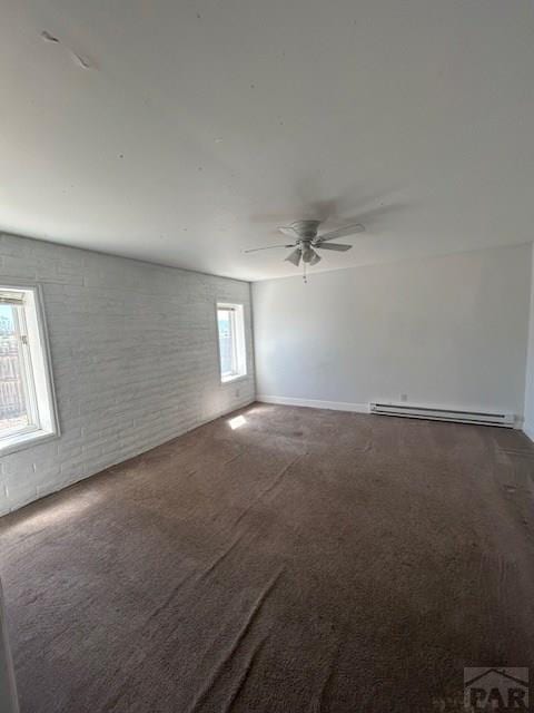21 Terrace Dr, Pueblo, CO 81001 - carpeted empty room featuring a baseboard radiator and a ceiling fan