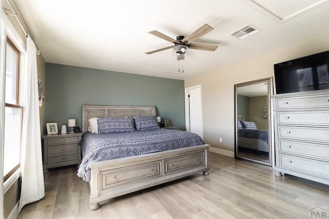 1108 W Meadowmoor Dr, Pueblo West, CO 81007 - bedroom featuring wood finished floors, baseboards, a ceiling fan, and visible vents