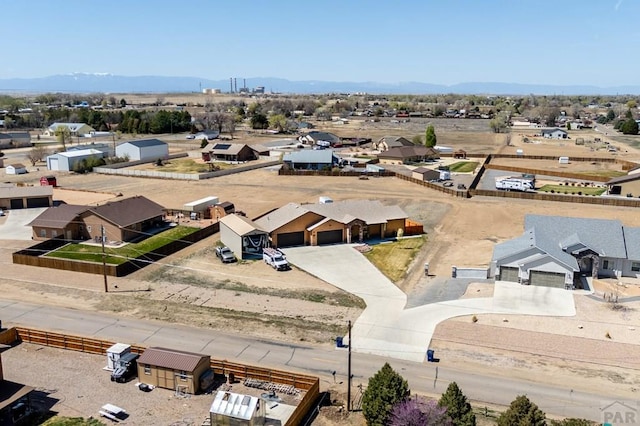 1557 28th Ln, Pueblo, CO 81006 - aerial view of residential area featuring a mountainous background