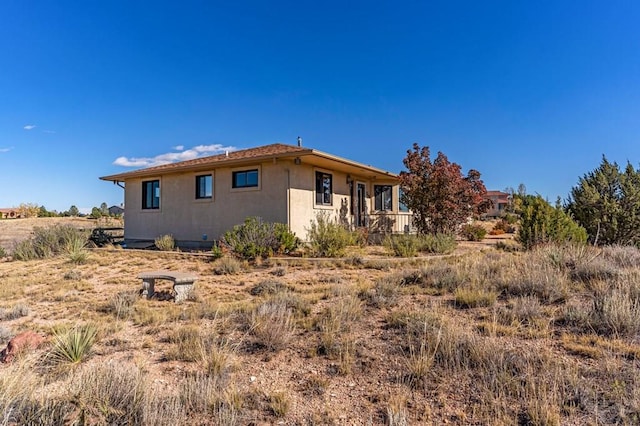 view of property exterior with stucco siding