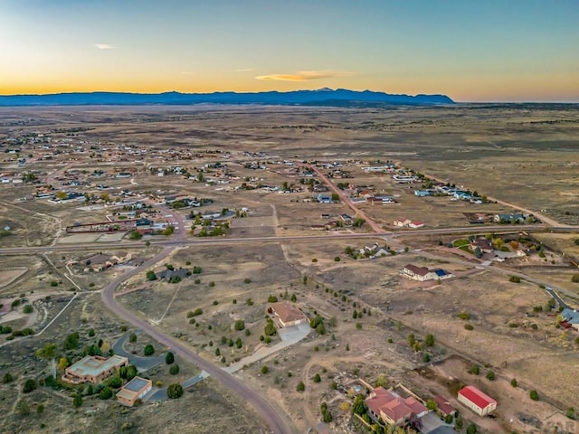 aerial view at dusk with a mountain view