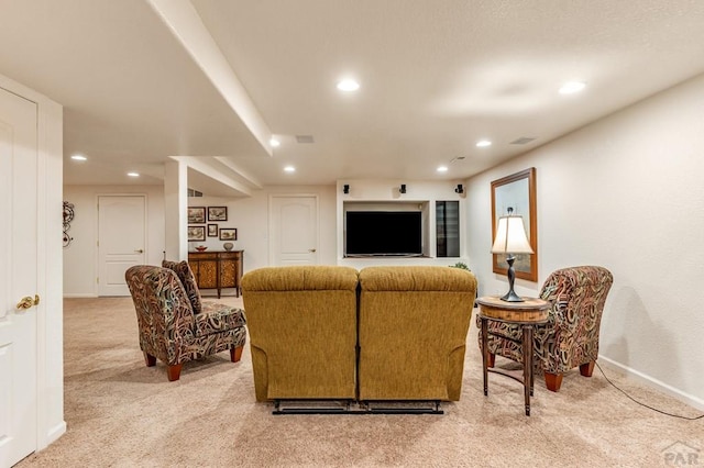 carpeted living room featuring recessed lighting, visible vents, and baseboards