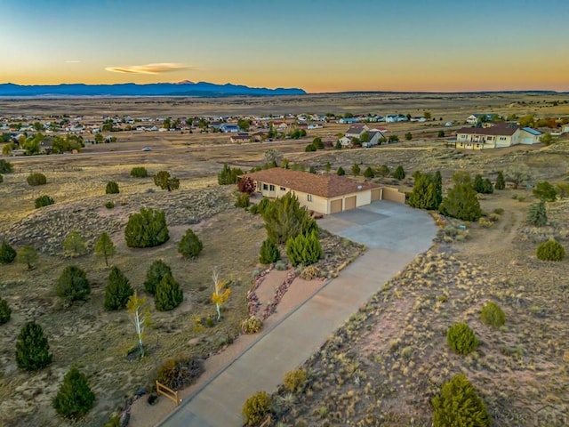 drone / aerial view featuring a mountain view