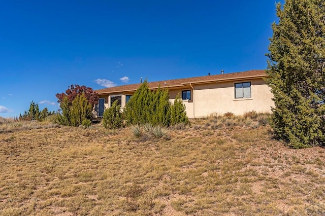 view of home's exterior with stucco siding