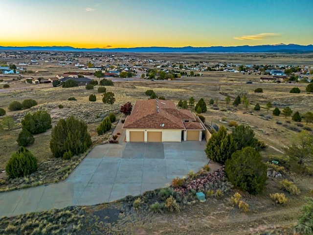 aerial view at dusk with a mountain view