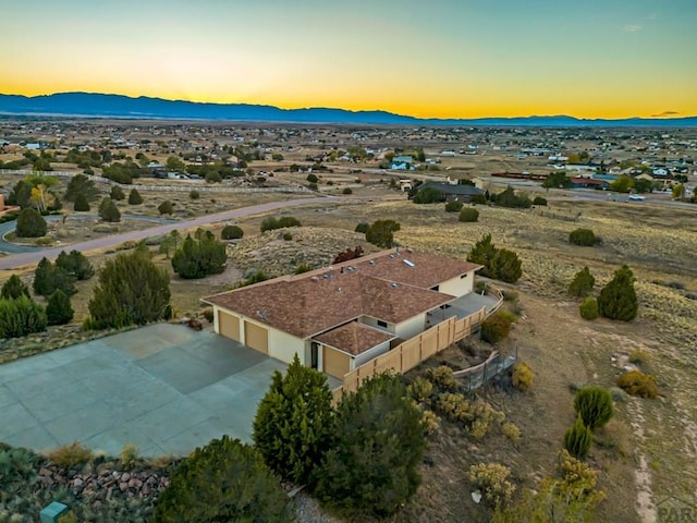 drone / aerial view featuring a mountain view