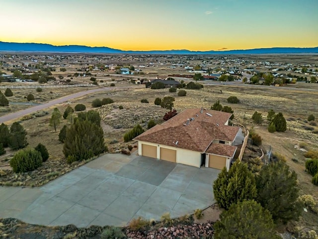 aerial view at dusk with a mountain view