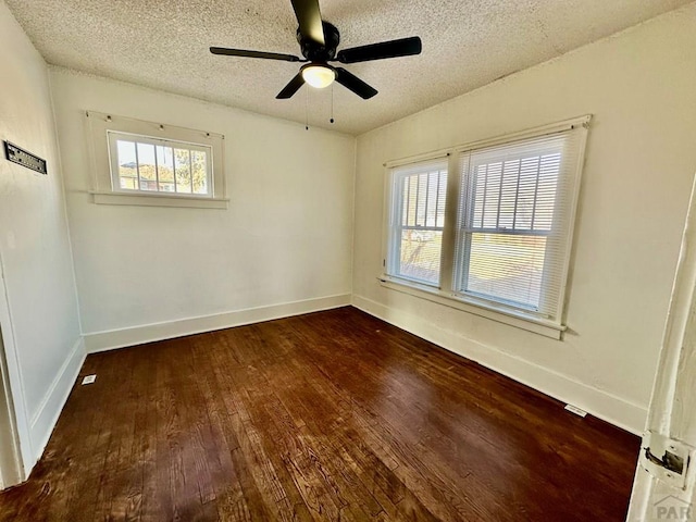 410 W 25th St, Pueblo, CO 81003 - unfurnished room with hardwood / wood-style flooring, a textured ceiling, baseboards, and a ceiling fan