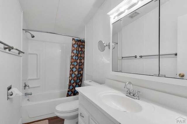 bathroom with toilet, visible vents, shower / tub combo with curtain, and vanity