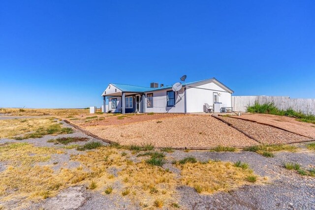 view of front of home with fence