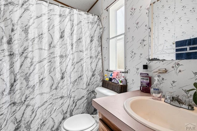 2100 W 100th Ave Unit 394, Thornton, CO 80260 - full bathroom with vanity, wallpapered walls, and curtained shower