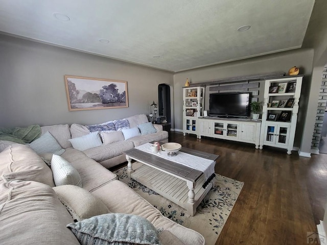 2602 3rd Ave, Pueblo, CO 81003 - living room featuring dark wood-type flooring and arched walkways